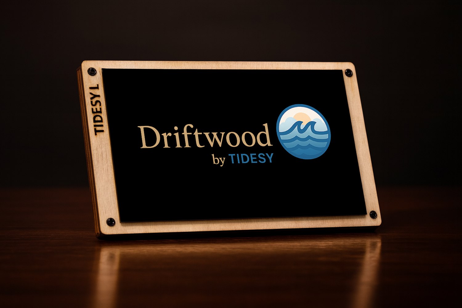 A Driftwood device showing the Driftwood by Tidesy logo on screen, in a basswood frame